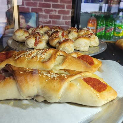 Hot and Ready Your Way: Fast Pick-UP or Fresh Delivery at The Pizza House